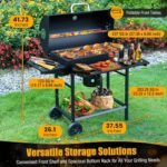 Portable outdoor cooking for BBQ grill with two wheels for easy movement around patio or backyard.